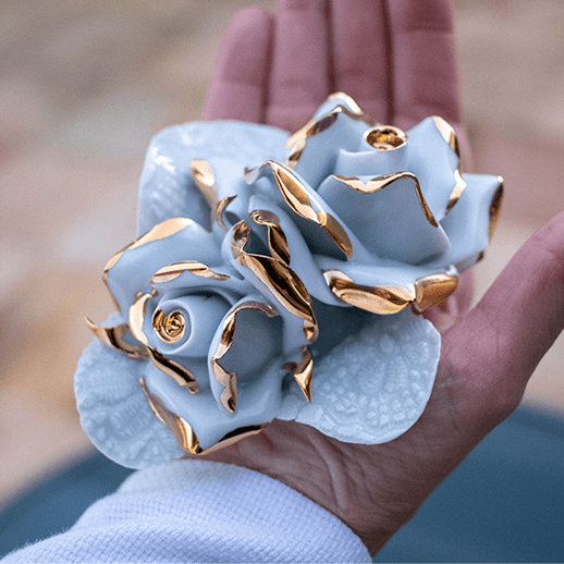 Porcelain flower with golden edges.